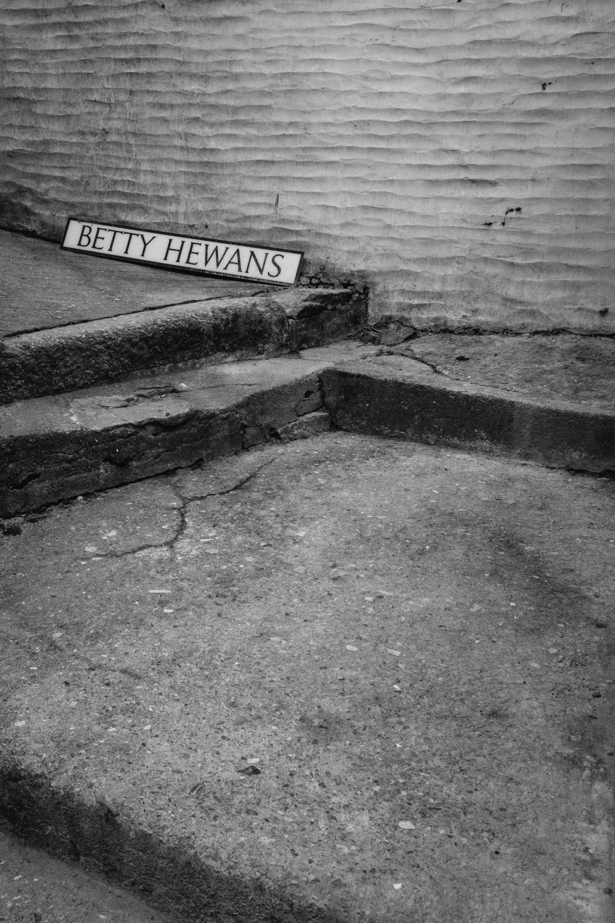 Worn steps at Polruan, Cornwall. Photographed in black and white.