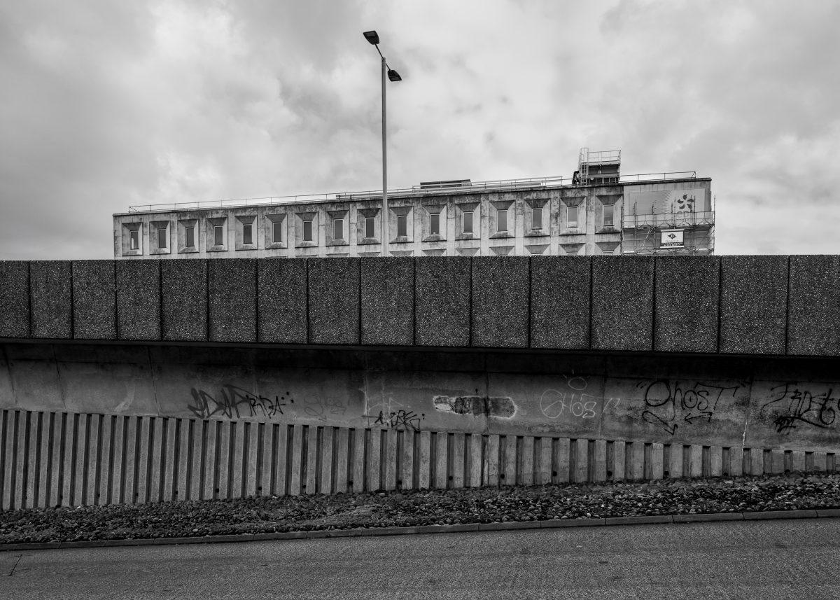 View from A38 sliproad towards an example of brutalist architecture in Plymouth