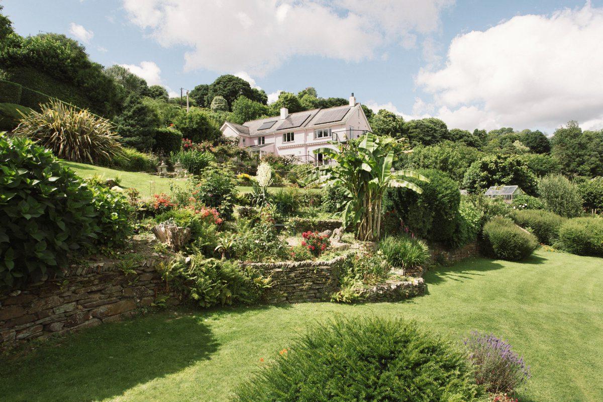 Elevated photograph of Waterside home located along the Fowey River in Cornwall.