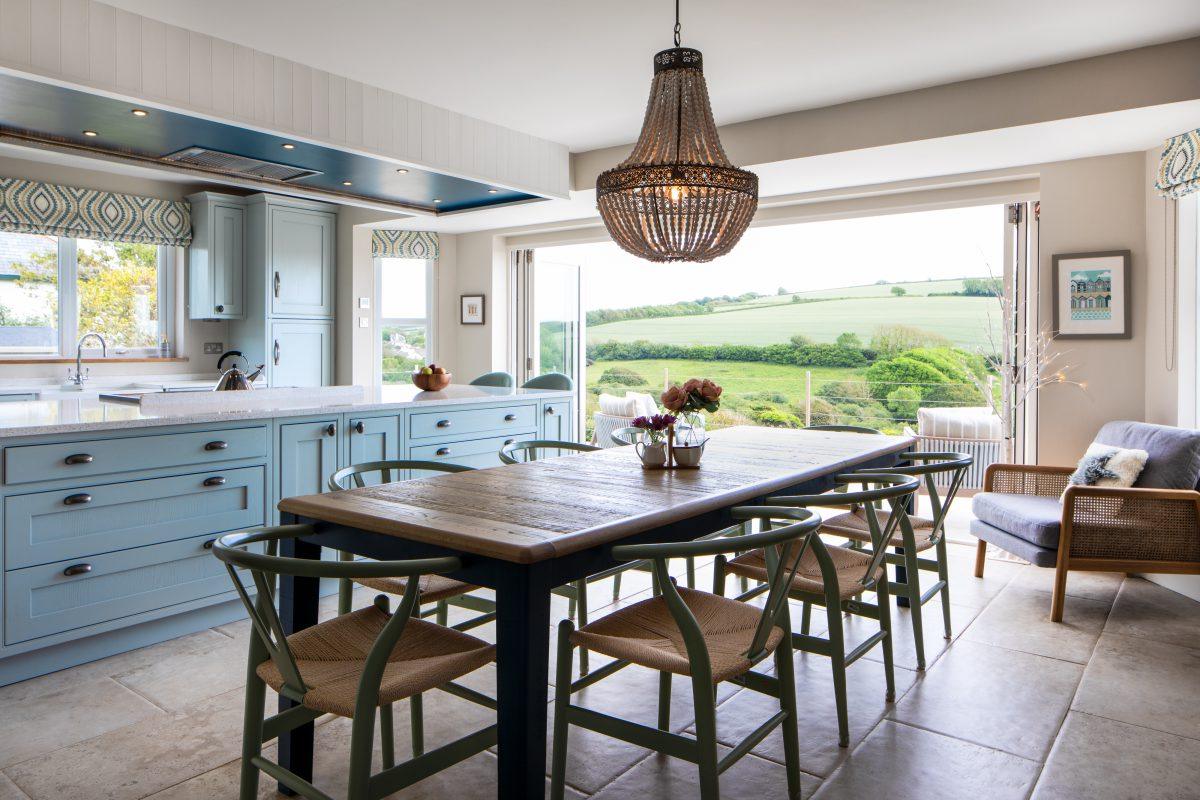 Large dining table in an open plan kitchen dining room. The home is located in the South Hams region of Devon.