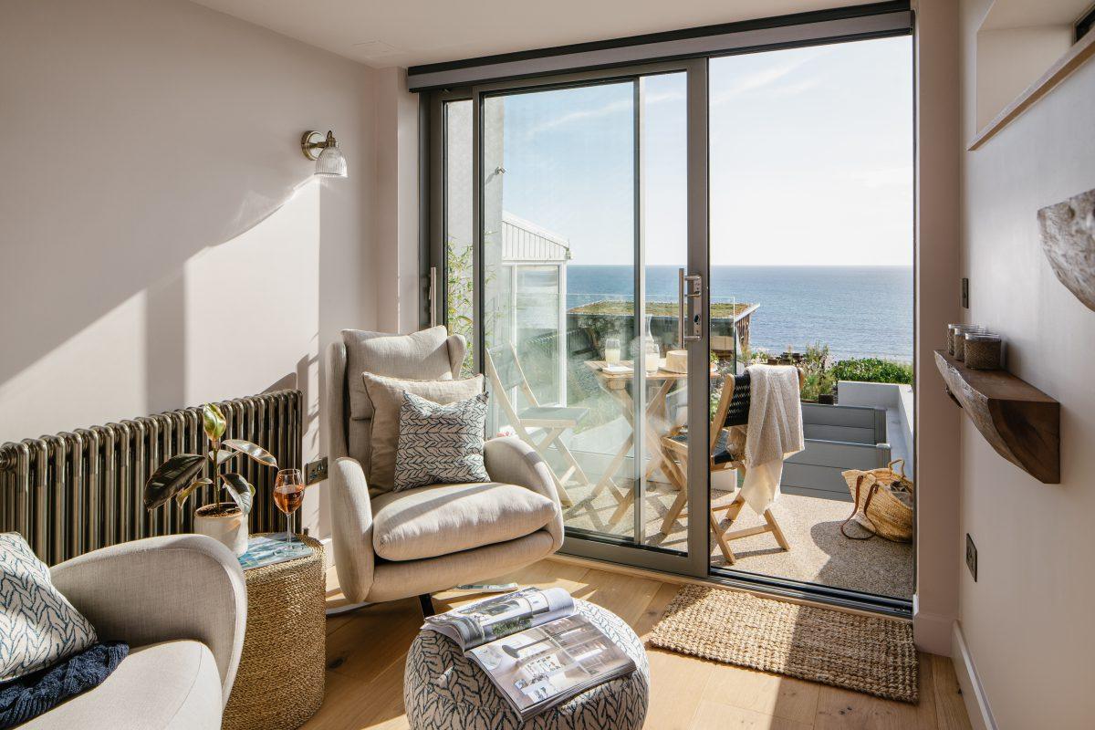 Professionally styled lounge interior with sea views in Cornwall.