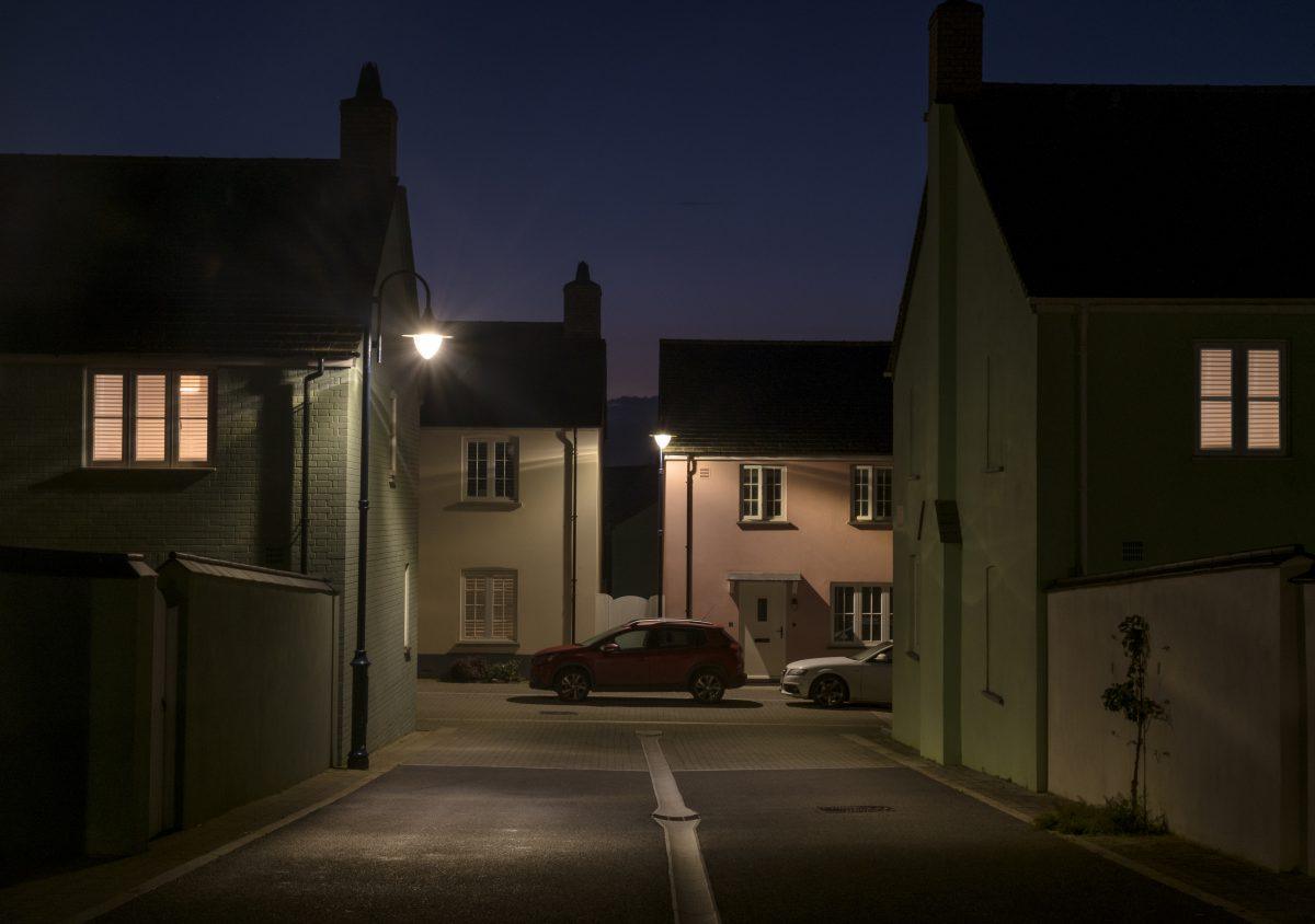 Dusk shot showing a car parked at the end of a street in Nansledan, Newquay, Cornwall.