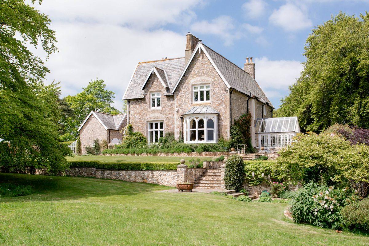 Victorian home surrounded by garden with trees and plants. Located in the Truro area of Cornwall.